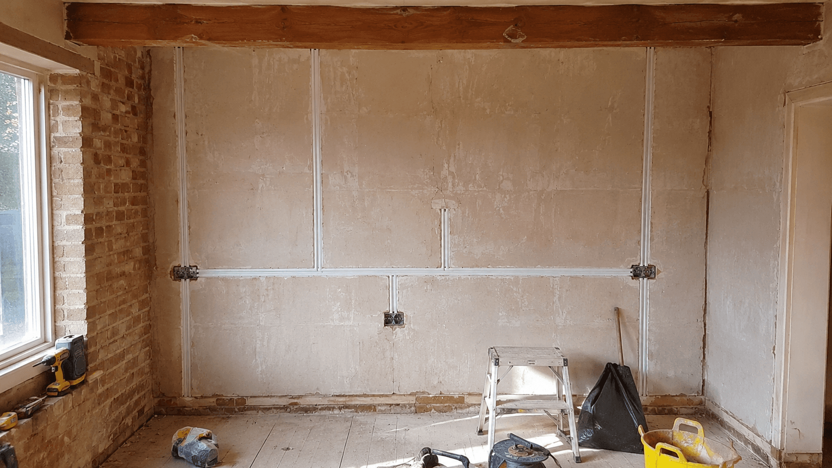 Room prepared for house rewiring with new surface cable routes