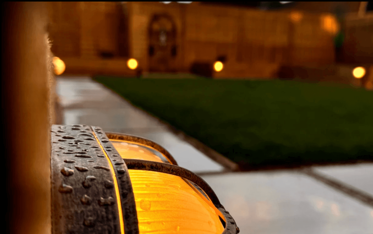 Warm garden path lighting after rain