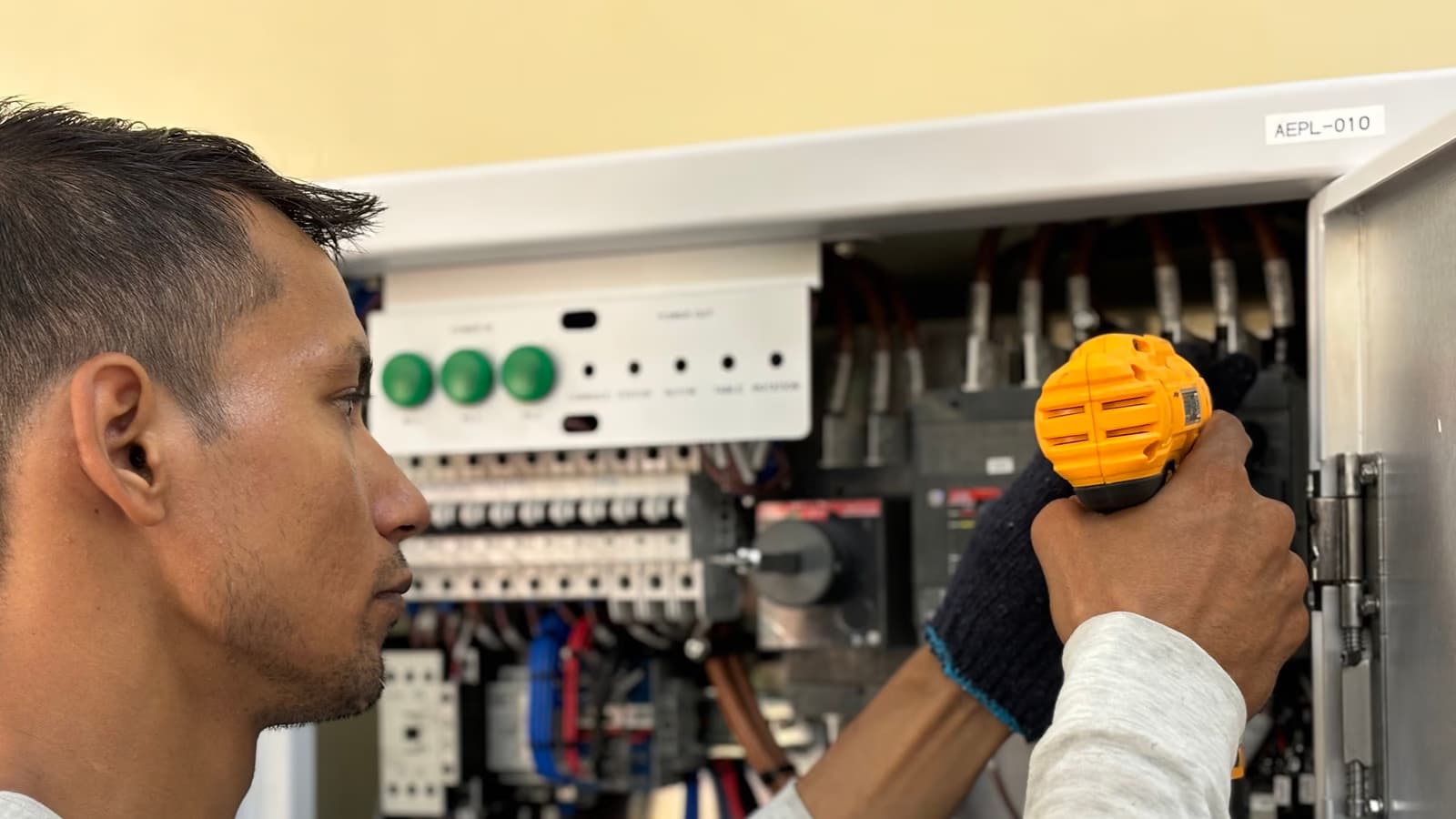Electrician testing a consumer unit during an emergency electrical fault call-out